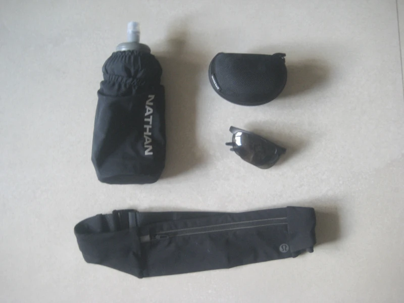 soft flask, sunglasses with case and running belt